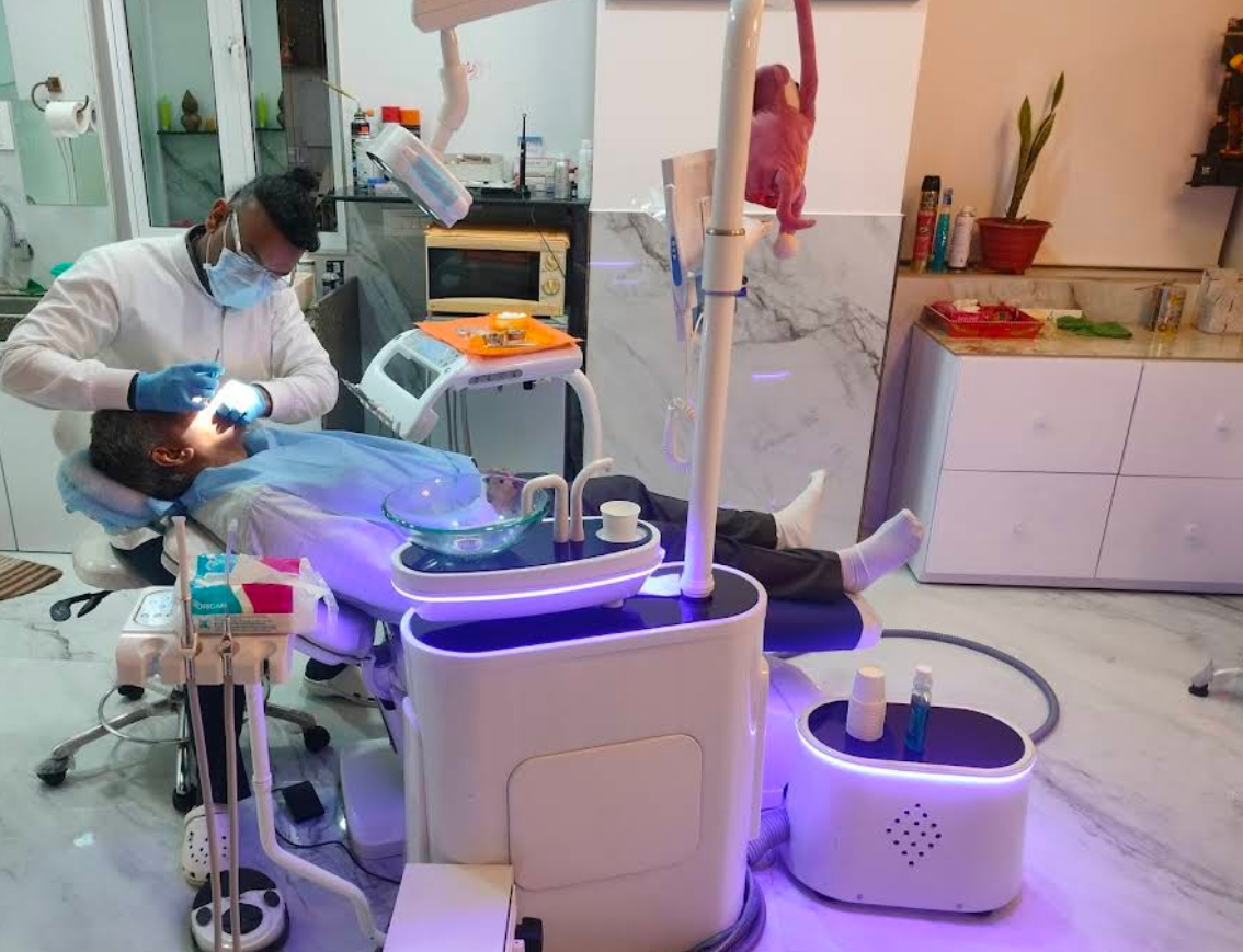 Dr. Amar Hegde treating a patient in the dental chair